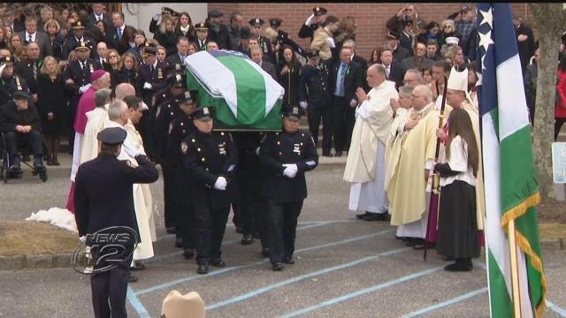 Fallen NYPD detective promoted during funeral Mass