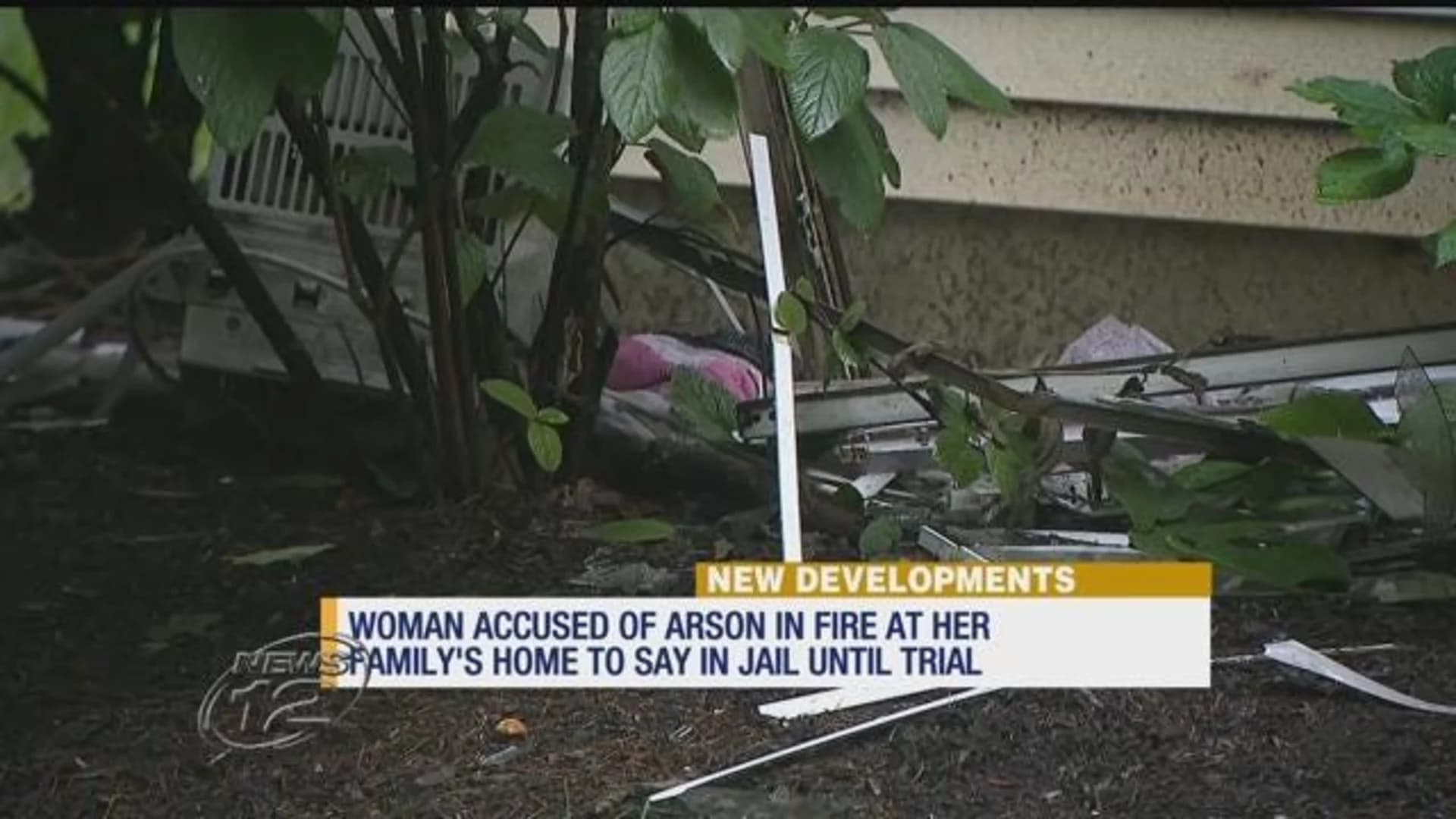 Woman accused of setting fire at her home will remain jailed